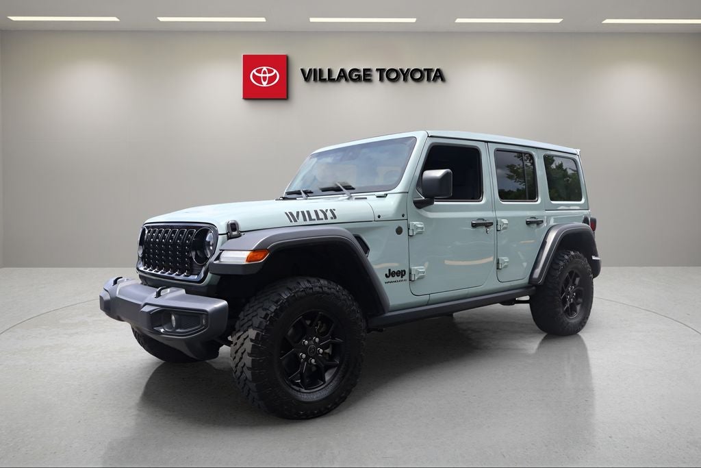 2024 Jeep Wrangler Sport in Earl Clearcoat — front three-quarter view
