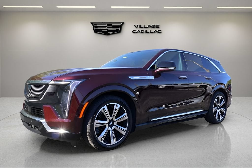 2025 Cadillac ESCALADE IQ Luxury 2 in Black Cherry Tintcoat — front three-quarter view