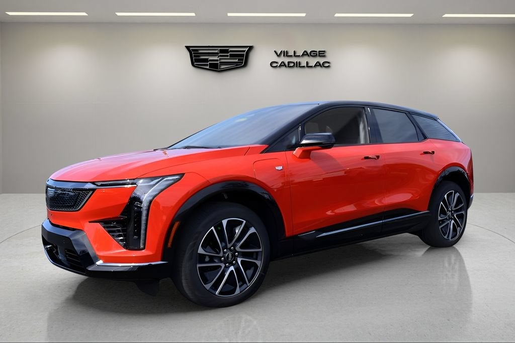 2026 Cadillac OPTIQ Sport in Monarch Orange — front three-quarter view