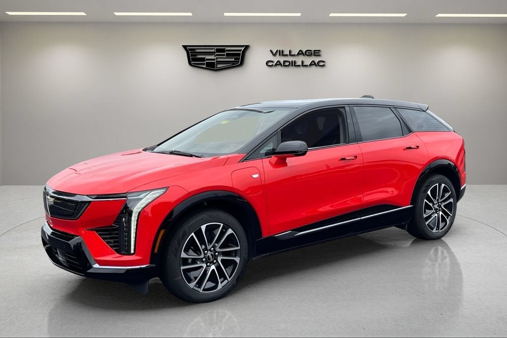 2026 Cadillac OPTIQ Premium Sport in Monarch Orange — front three-quarter view